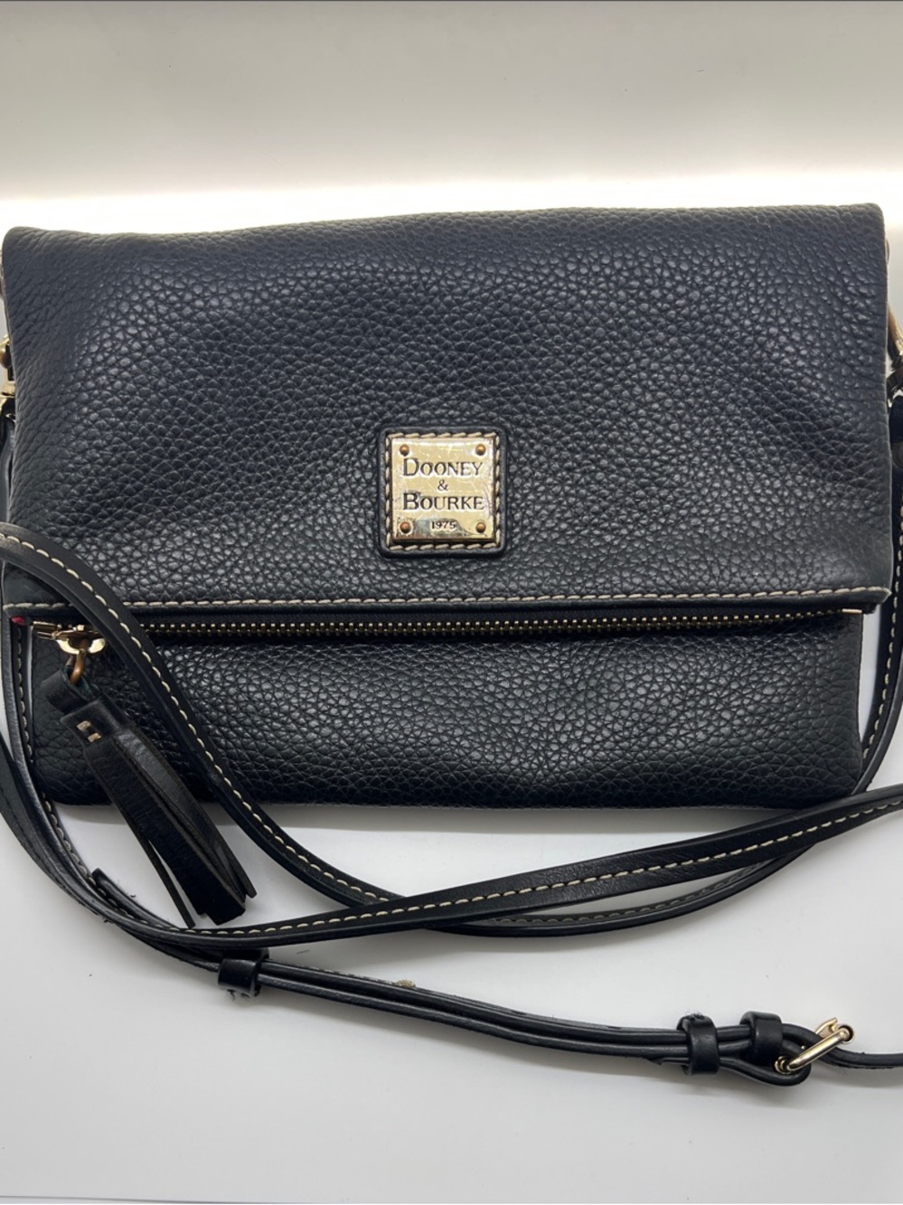 Dooney & Bourke Black Pebbled Leather Fold-Over Crossbody with Tassel